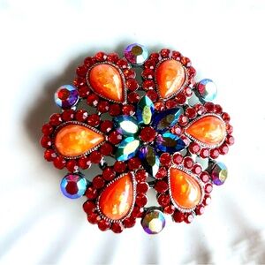NWOT.  Cara Women’s Iridescent Orange, Red & Blue Floral Design Crystal Brooch.